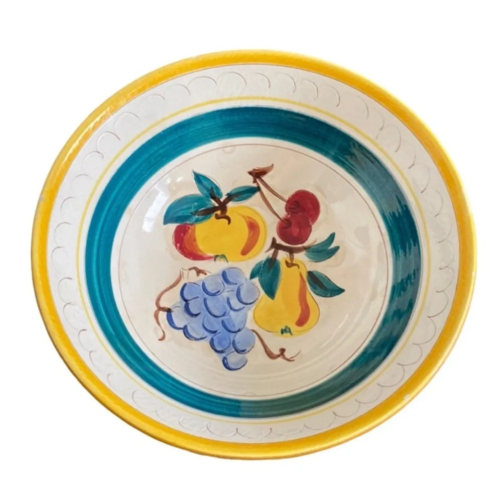 Strangl Pottery fruit bowl. Renton, NJ. Off white,yellow,green. 9.5” diameter.